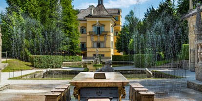 Ausflug mit Kindern - Salzburg-Stadt (Salzburg) - Wasserspiele: Fürstentisch - Schloss und Wasserspiele Hellbrunn
